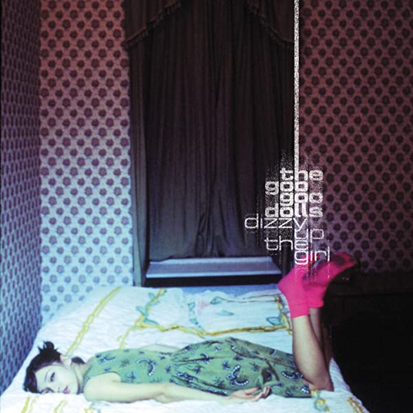 The album artwork of the goo goo dolls album dizzy up the girl